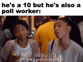 Video gif. At the top reads the header, “He’s a 10 but he’s also a poll worker.” The video below shows two women at a table, smiling. One says, “Girl that is boyfriend material.”