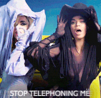 Music video gif. Lady Gaga and Beyonce in Telephone sing to us, respectively wearing white and black dresses, veils, and hats. Text, "Stop telephoning me."