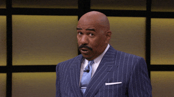 TV gif. Steve Harvey on Steve Harvey TV. He leans back and stares at something for a moment before showing all his teeth and chuckling.