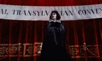 tim curry confused travolta GIF