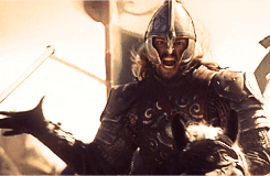 Movie gif. Karl Urban as Éomer in Lord of the Rings Return of the King charges into battle.