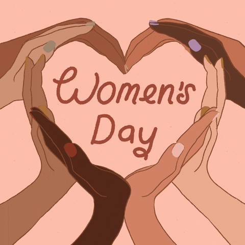 Illustrated gif. Different hands with different skin tones come together to make a heart shape. In the center of the hand heart is text that reads, “Women’s day.”