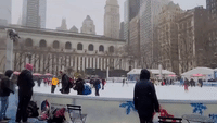 Bryant Park Winter Village Full of Skaters During New York City Snow Day