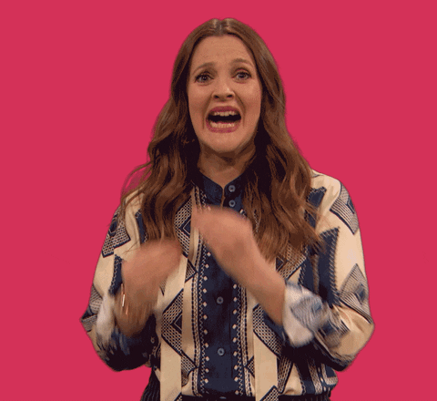 Celebrity gif. Looking worried, Drew Barrymore chatters her teeth and holds her fingers up like she's pretending to bite her nails.