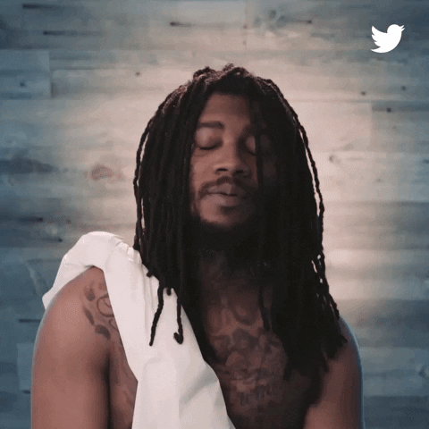 Ad gif. Dressed in a white toga, Lil B raises his hands together in prayer, and a Twitter-blue halo descends onto his head.