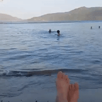 Tourists Swim Along Turkish Coast as Helicopters Fight Encroaching Fires