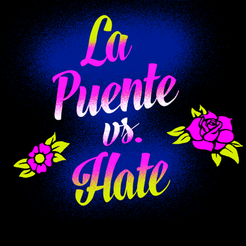 Text gif. Graphic graffiti-style painting of feminine script font and stenciled tattoo flowers, all in neon pink and chartreuse, text reading, "La Puente vs hate," then hate is sprayed over with the message, "Call 211, to report hate."