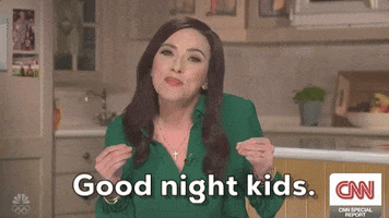 SNL gif. Scarlett Johansson as Katie Britt on Weekend Update. She smiles and holds both hands up like claws as she says scrunches her face and says, "Good night kids," which appears as text.