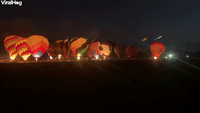 Hot Air Balloons Light up the Night Sky