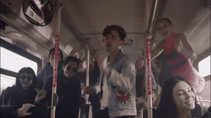gif of young people dancing on a bus