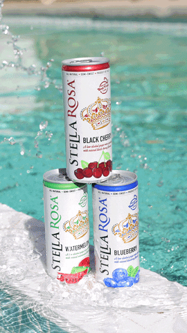 Ad gif. Three stacked cans of Stella Rosa wine sit on the edge of a swimming pool as water splashes over them.