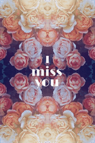 Digital art gif. An array of warm yellow and pink flowers create a heartfelt background. Text grows from the blooms, "I miss you."