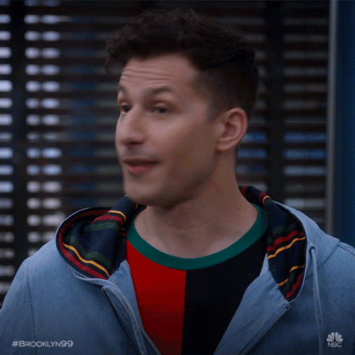 TV gif. Actor Andy Samberg on Brooklyn Nine-Nine excitedly says "Oh!" before breaking into a wide-mouth smile.