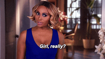 Reality TV gif. Wearing a blue dress, Cynthia Bailey from Real Housewives of Atlanta gives us a skeptical look. Text, "Girl, really?"