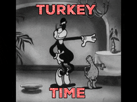 Cartoon gif. Bimbo from Betty Boop is dancing with a headless turkey. They're dancing in sync and Bimbo has a wide smile over his face. Text, "Turkey Time."