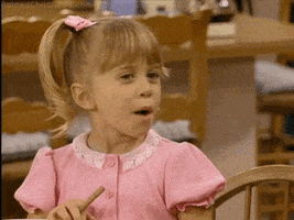 TV gif. Mary-Kate or Ashley Olsen, as pigtailed young Michelle in Full House, says something sassily. Text, “Bitch, what?”