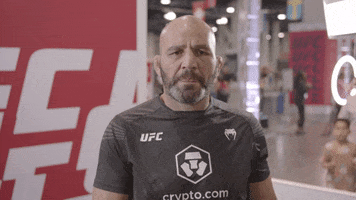 Sports gif. UFC fighter Glover Teixeira points at us, shaking his head and wagging his finger in disapproval.