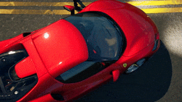 Video game gif. A Ferrari in Fortnite is being shown off as the camera pans on different angles of the racecar.