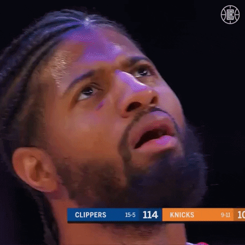 Sports gif. Paul George from the LA Clippers stares upwards, waiting for something. His mouth hangs slightly open and he looks as if he's in great anticipation. 