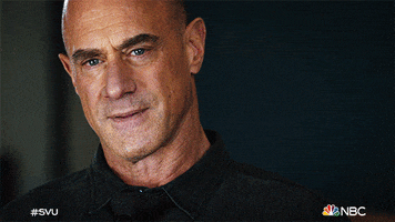 TV gif. Chris Meloni as Elliot Stabler on Law and Order Organized Crime stares out, squinting his eyes and biting his lip as he thinks hard about something. He nods slightly as his eyes dart around. 