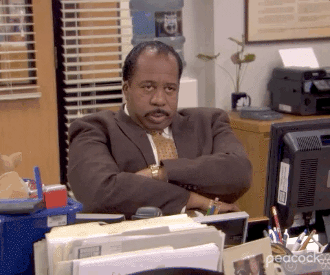 The Office gif. Leslie David Baker as Stanley Hudson looks pointedly across the room, his arms folded over his chest in a way that says, "I'm over this."