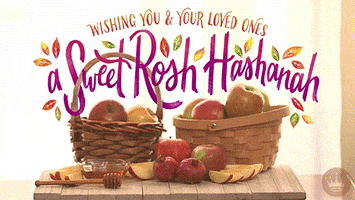 Digital illustration gif. Table full of apples, pomegranates, and honey with text that reads, "Wishing you and your loved ones a sweet Rosh Hashanah," as fall leaves sway softly throughout the text.
