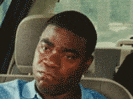 Movie gif. Tracy Morgan as Paul in Cop Out sits in a car and shakes his head fast as he yells, “No, hell no, no!”