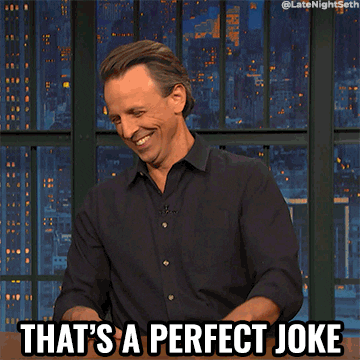 TV gif. Seth Meyers on Late Night slams his hand on his desk as he laughs at himself, and says, “that’s a perfect joke” to the camera