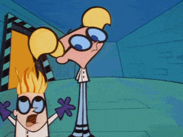 Cartoon gif. From Dexter's Laboratory, Dexter runs in circles, panicking with his hair on fire, around DeeDee whose eyes follow him stoically.
