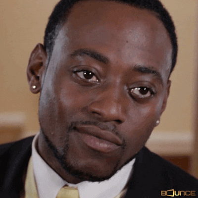 Video gif. Actor Omar Epps looks past the camera at someone he's obviously very attracted to, his eyes filled with lust as he bites his lip. He's thinking, "Damn, she looks good."