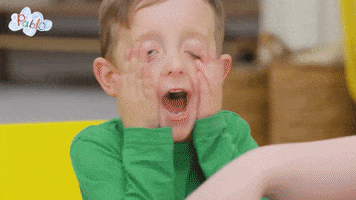 TV gif. William or Oliver Burns as Pablo with his hands over his eyes, pulling down his face, turning away from his chair to get away.