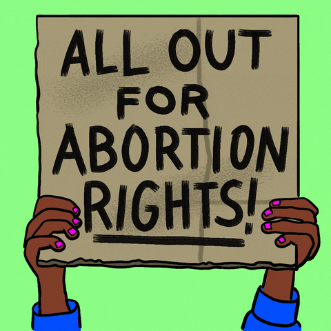 Digital art gif. Manicured hands hold up a cardboard protest sign over a lime green background with the message, “All out for abortion rights!”

