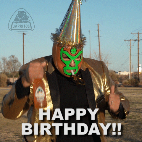 Ad gif. A large man in a luchador mask and a tall party hat dances around while holding a bottle of Jarritos. Text, "Happy birthday!"