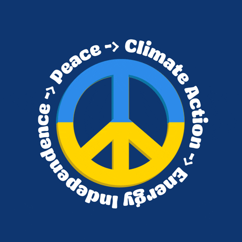 Illustrated gif. Sky blue and yellow peace sign appears on a navy blue background. Text rotating around the perimeter with chasing arrows in between phrases reads, "Climate action, energy independence, peace."