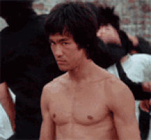 staring bruce lee GIF