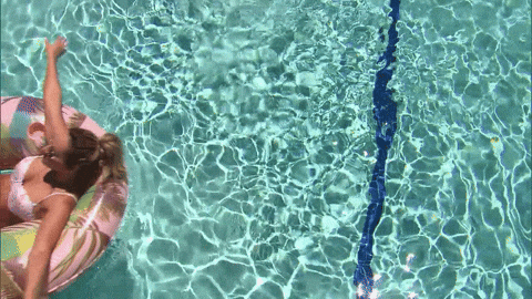 Woman relaxing in the swimming pool after the SMILE laser vision correction procedure.