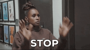 SNL gif. Issa Rae holds her palms out in front of her chest as she says, "Stop."