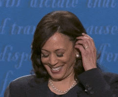 Political gif. Kamala Harris puts her hands together and rests them under her chin as if to say "I'm listening."