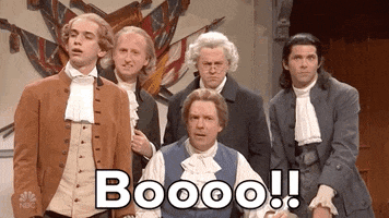 SNL gif. Four SNL cast members and Jason Sudeikis gather together, all dressed in colonial-era clothes and powdered wigs. One man yells, "Booo!" which appears as text, and the others join in.