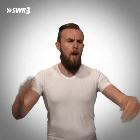 Video gif. Dominik from SWR3, a German media group, looking pumped up. He's dancing by himself and he launches into a hand jive, grooving along.