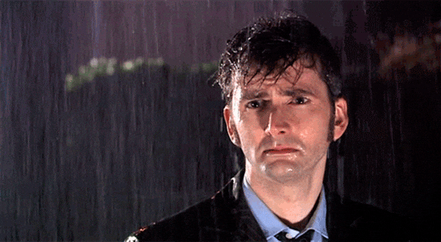 Giphy - disappointed standing in the rain GIF