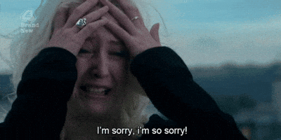Video gif. A woman is sobbing and clutching her face, her hair completely disheveled. She has tears in her eyes as she says, "I'm sorry, I'm so sorry!"