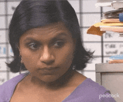 The Office gif. Mindy Kaling as Kelly gives an intimidating glare. As she walks away she makes several theaterning motions with her hands. She first makes a W and a L on her forehead and then slides a finger across her throat. 