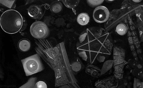 candle magic being practised gif