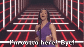 Celebrity gif. Cardi B at the 2019 Billboard Music Awards smiles as she says into the mic, "I'm outta here! Bye!" and then turns around to walk off.