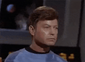 TV gif. William Shatner as Kirk and Deforest Kelley as Leonard on Star Trek firmly nod to each other in complete agreement.