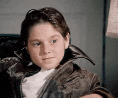 TV gif. A kid from Happy Days dressed just like Fonzie nods and gives a thumbs-up.