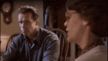 Arnold Schwarzenegger Stare In True Lies GIF
