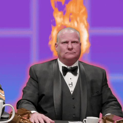Sports gif. In a tux with animated flames coming out of his head, Sports commentator Stu Feiner shakes his head and holds up his hands in disbelief and says, “I'm hot.”