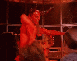 Video gif. A red devil character with ram horns does the booty slap with a pelvic thrust and one arm slapping back and forth.